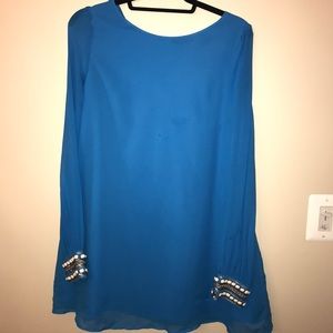 Bright blue dress with white gem cuffs